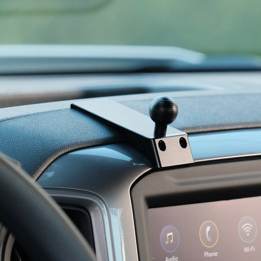 Image of Offroam Mounting Base installed securely in Chevrolet Silverado 2019-2026 | Silverado HD 2020-2026 & GMC Sierra 1500 2019-2026 | Sierra HD 2020-2026 with 7-in.|8-in. display. This premium all metal phone mounting base installs easily without drilling or glue. Perfect placement without blocking screens, driver view, or air flow.