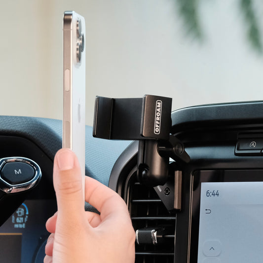 Image of Offroam Phone Mount installed securely in Ford F-150 2021-2025 | F-250/F-350 2023-2025 | F-150 Lightning (XL & PRO) 2022-2025. This premium phone mount installs easily without drilling or glue. Spring loaded Universal holder for use with any phone. Perfect placement without blocking screens, driver view, or air flow. Fully adjustable positioning.