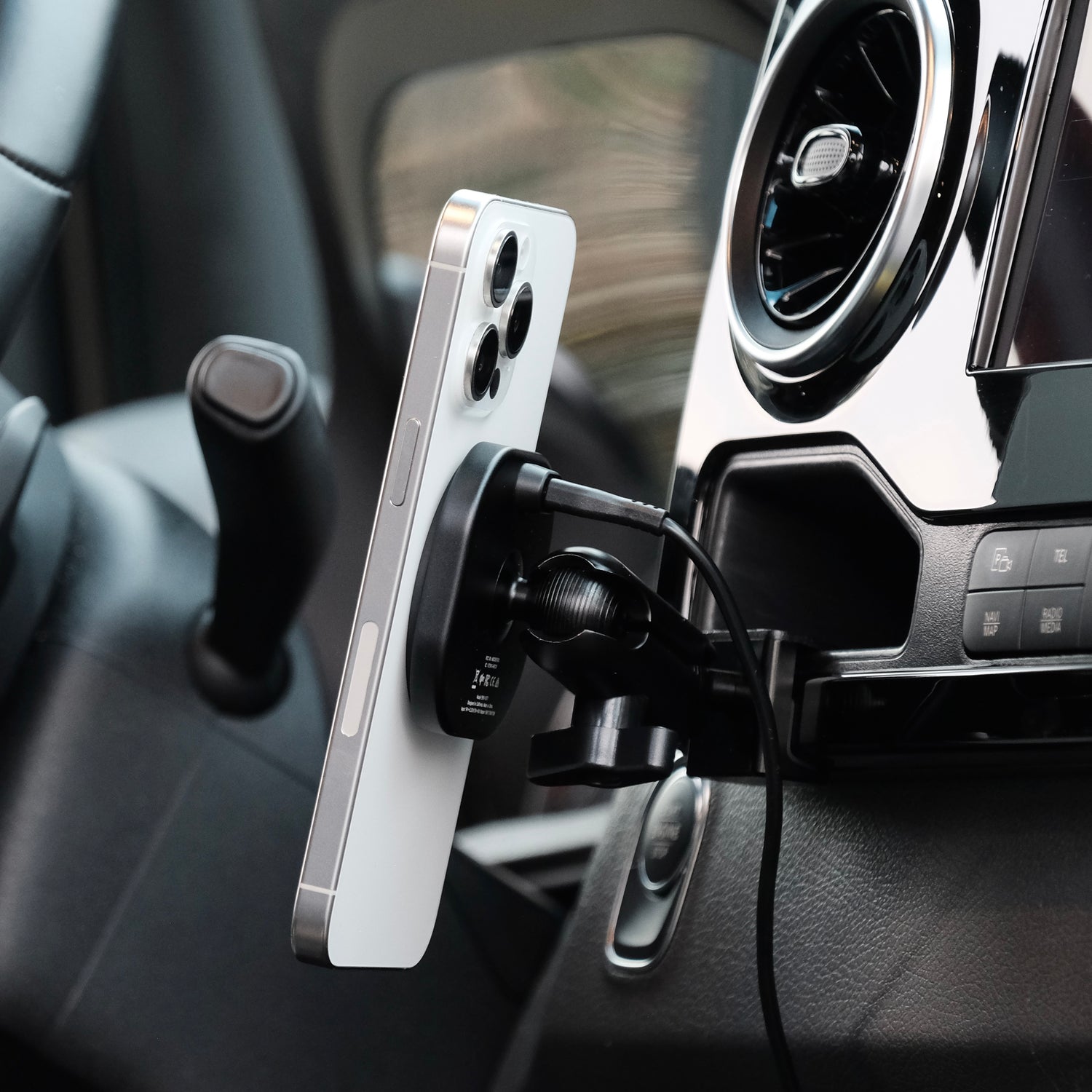 Image of Offroam MagSafe-compatible Phone Mount installed securely in Mercedes-Benz Sprinter 2019-2026. This premium phone mount installs easily without drilling or glue. High force magnets hold phone on any trail, road, or track. Perfect placement without blocking screens, driver view, or air flow. Fully adjustable positioning.
