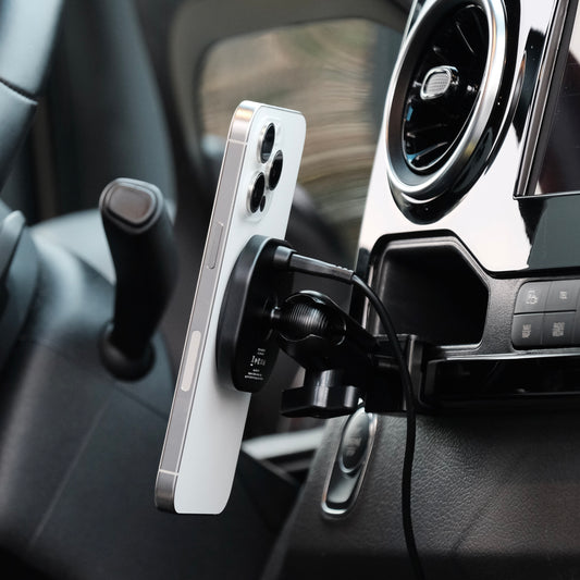 Image of Offroam MagSafe-compatible Phone Mount installed securely in Mercedes-Benz Sprinter 2019-2025. This premium phone mount installs easily without drilling or glue. High force magnets hold phone on any trail, road, or track. Perfect placement without blocking screens, driver view, or air flow. Fully adjustable positioning.