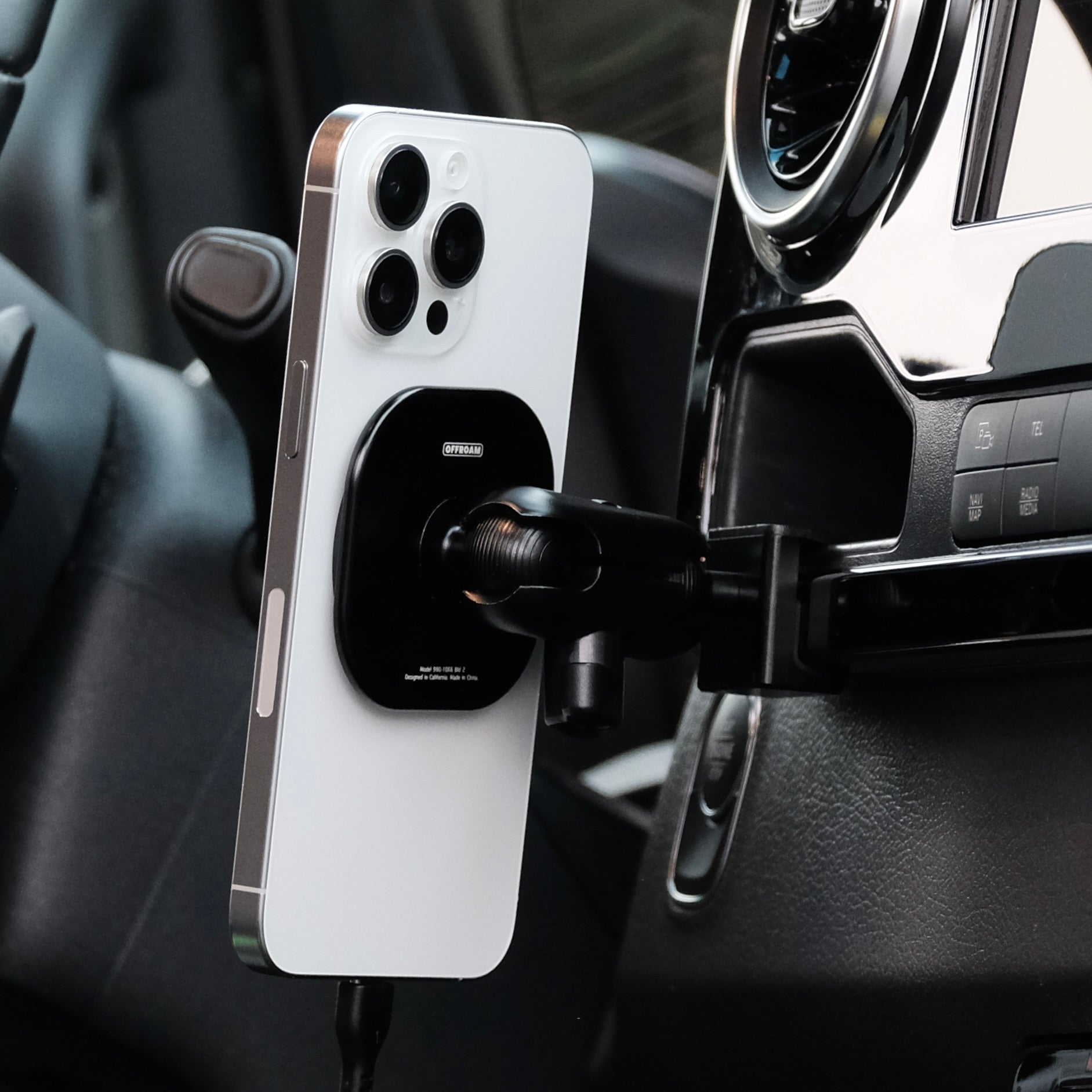Image of Offroam MagSafe-compatible Phone Mount installed securely in Mercedes-Benz Sprinter 2019-2025. This premium phone mount installs easily without drilling or glue. High force magnets hold phone on any trail, road, or track. Perfect placement without blocking screens, driver view, or air flow. Fully adjustable positioning.