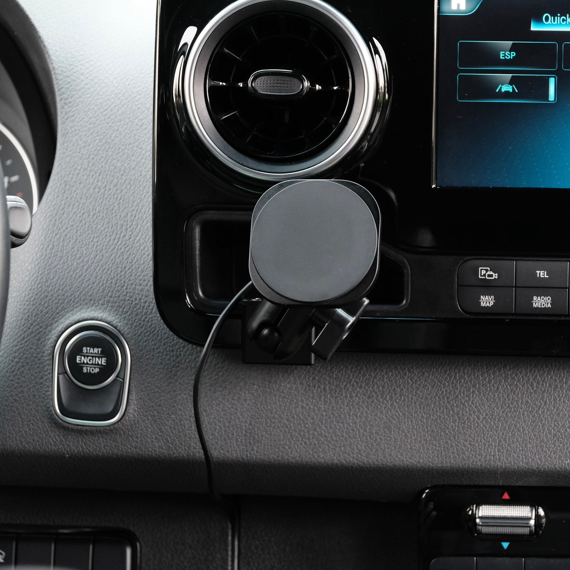 Image of Offroam MagSafe-compatible Phone Mount installed securely in Mercedes-Benz Sprinter 2019-2025. This premium phone mount installs easily without drilling or glue. High force magnets hold phone on any trail, road, or track. Perfect placement without blocking screens, driver view, or air flow. Fully adjustable positioning.