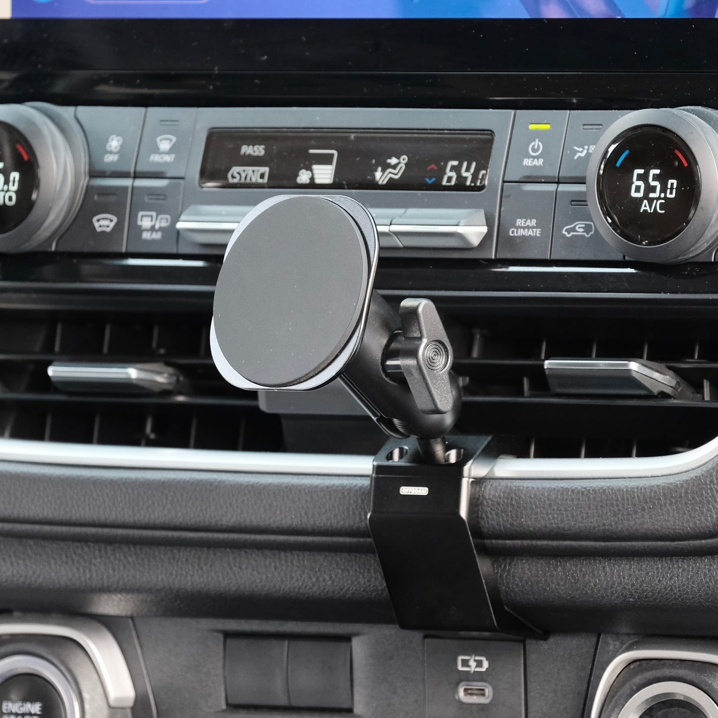 Image of Offroam MagSafe-compatible Phone Mount installed securely in Toyota Grand Highlander 2024-2026. This premium phone mount installs easily without drilling or glue. High force magnets hold phone on any trail, road, or track. Perfect placement without blocking screens, driver view, or air flow. Fully adjustable positioning.