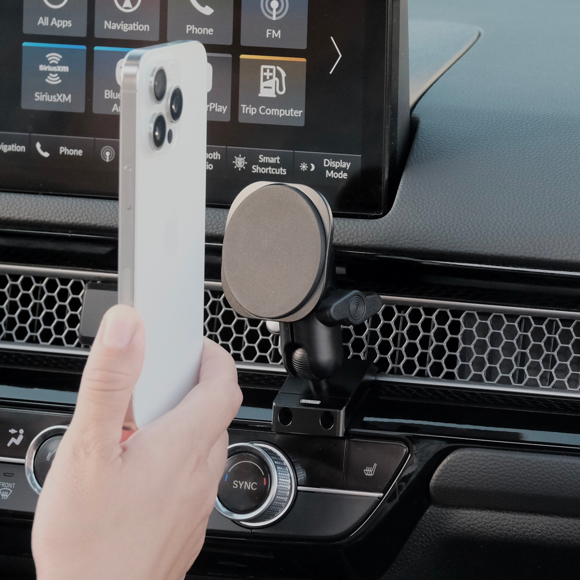 A MagSafe phone mount installed securely in Honda Civic & CR-V 2023-2025 features an all-metal design and existing features in the vehicle without adhesives or drilling. Strong magnets for racing and any road.