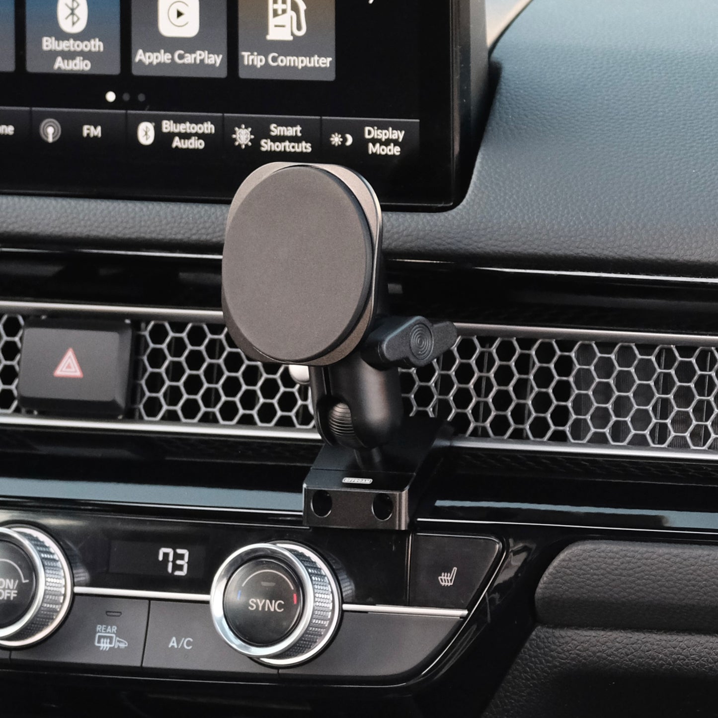 A MagSafe phone mount installed securely in Honda Civic & CR-V 2023-2025 features an all-metal design and existing features in the vehicle without adhesives or drilling. Strong magnets for racing and any road.