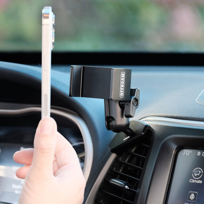 Offroam universal phone mount that accepts any phone and hold securely on any 4 x 4 trail shown installed securely to a air vent bezel of Jeep Cherokee 2014 2018 with a person offering the phone up to show the use of use