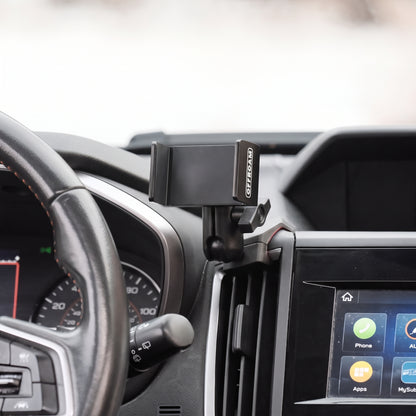 Image of Offroam Phone Mount installed securely in Subaru Crosstrek 2018-2023 | Forester 2019-2024| Impreza 2017-2023. This premium phone mount installs easily without drilling or glue. Spring loaded Universal holder for use with any phone. Perfect placement without blocking screens, driver view, or air flow. Fully adjustable positioning.