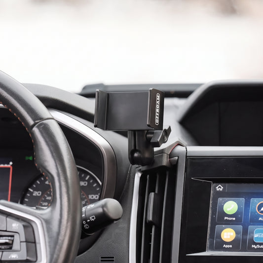 Image of Offroam Phone Mount installed securely in Subaru Crosstrek 2018-2023 | Forester 2019-2024| Impreza 2017-2023. This premium phone mount installs easily without drilling or glue. Spring loaded Universal holder for use with any phone. Perfect placement without blocking screens, driver view, or air flow. Fully adjustable positioning.