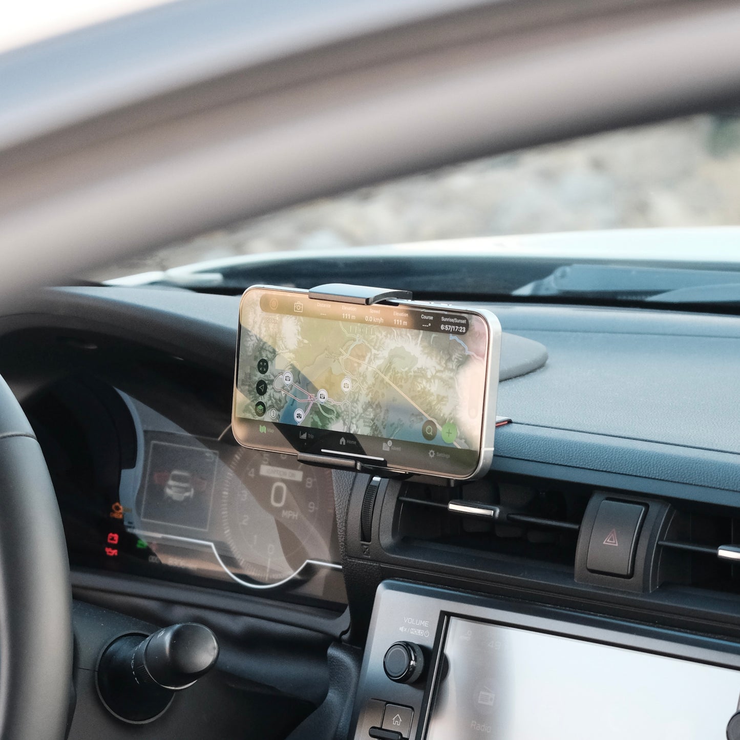 Offroam phone mount installed securely in Toyota GR86 or Subaru BRZ 2022-2025 near display screen is a premium accessory. Installs easily into existing features without drilling or glue. Perfect placement above air vent without blocking the screen, windshield or air flow. Fully adjustable positioning. Phone shown in landscape orientation.