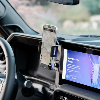 An Offroam phone mount installed securely in Toyota Land Cruiser 2024-2025 near display screen is a premium accessory. Installs easily into existing features without drilling or glue. Perfect placement above the start button without blocking the screen, windshield or air flow. Fully adjustable positioning.