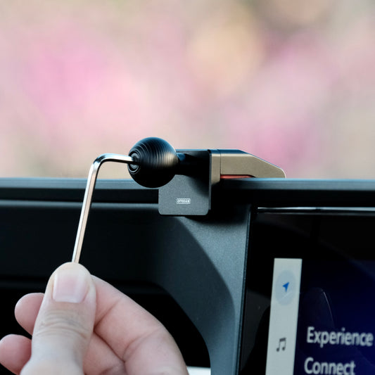 A premium mounting base installed securely in Toyota Land Cruiser 250 2024-2025 that allows to securely mount phone. Shown on installed on the dashboard with 20mm ball interface.