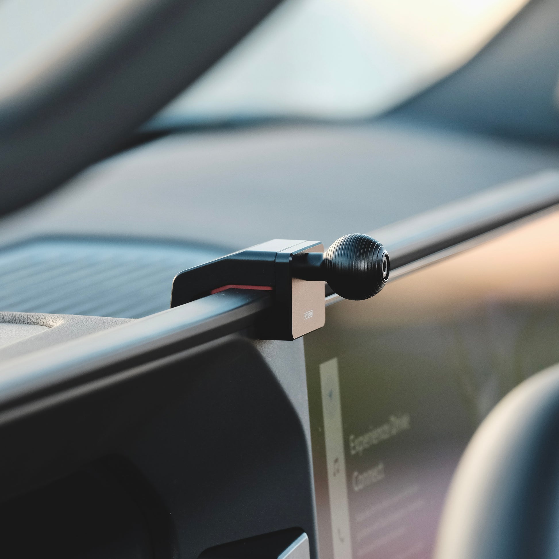 A premium mounting base installed securely in Toyota Land Cruiser 250 2024-2025 that allows to securely mount phone. Shown on installed on the dashboard with 20mm ball interface.