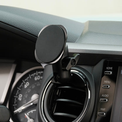 Offroam phone holder attached securely to Toyota Tacoma 2016-2023 air vent bezel with integrated 20mm ball mount interface. Showing Offroam articulating arm and a non-charging MagSafe-compatible holder with strong magnets.