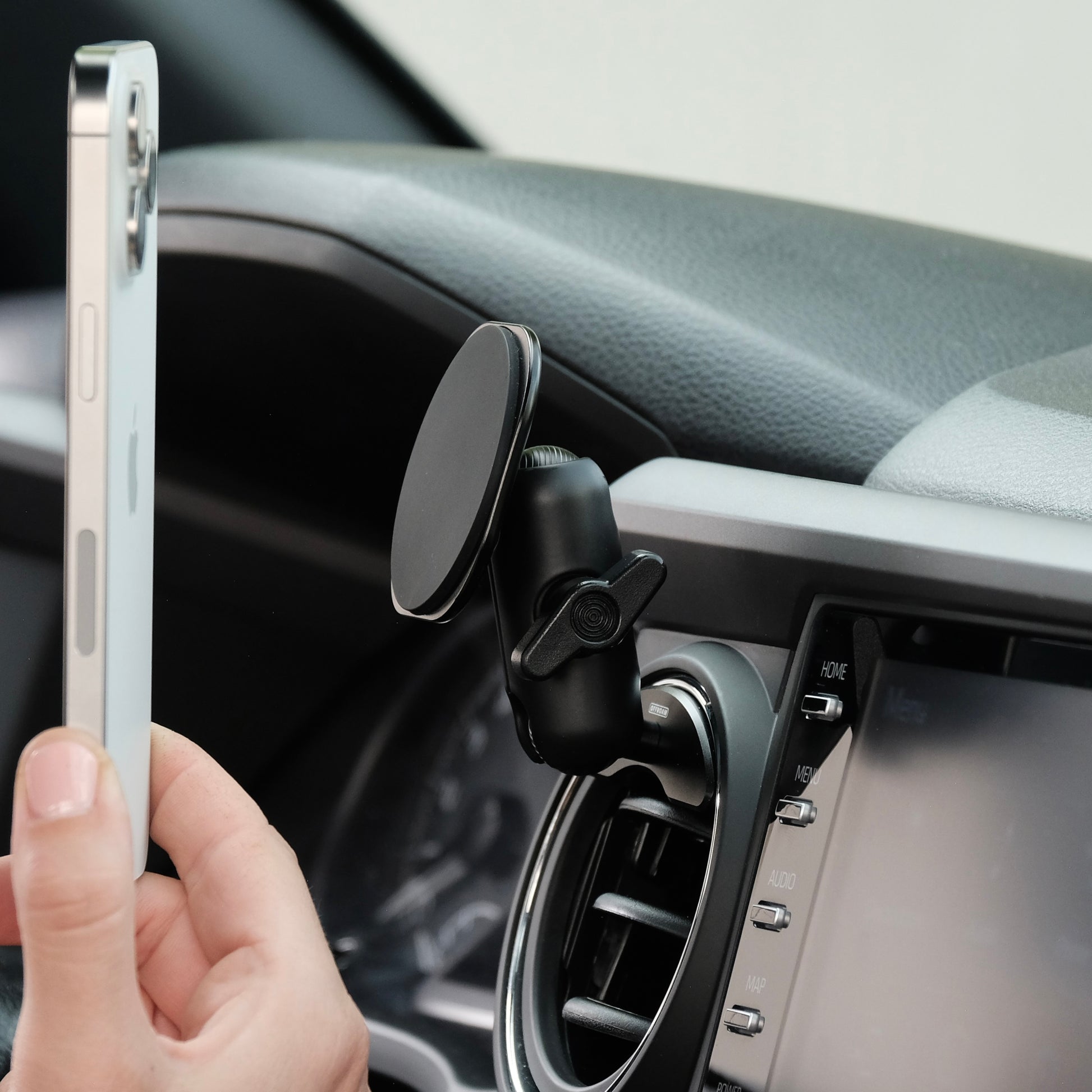 MagSafe-compatible phone holder shown in Toyota Tacoma 2016-2023 with easy one-hand operation and secure strong magnets built in.
