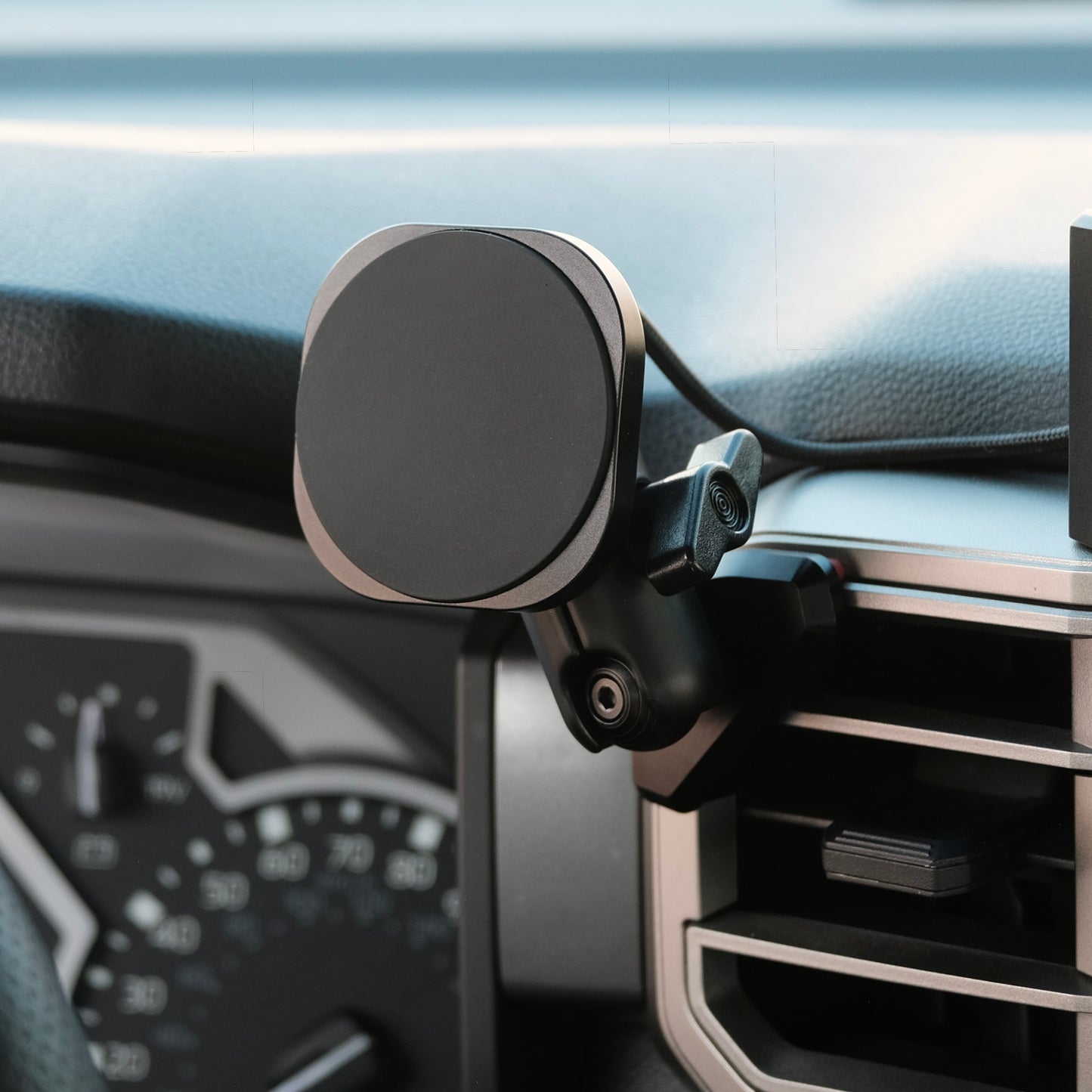 Image of Offroam MagSafe-compatible Phone Mount installed securely in Toyota Tundra 2022-2026 | Sequoia 2023-2026. This premium phone mount installs easily without drilling or glue. High force magnets hold phone on any trail, road, or track. Perfect placement without blocking screens, driver view, or air flow. Fully adjustable positioning.