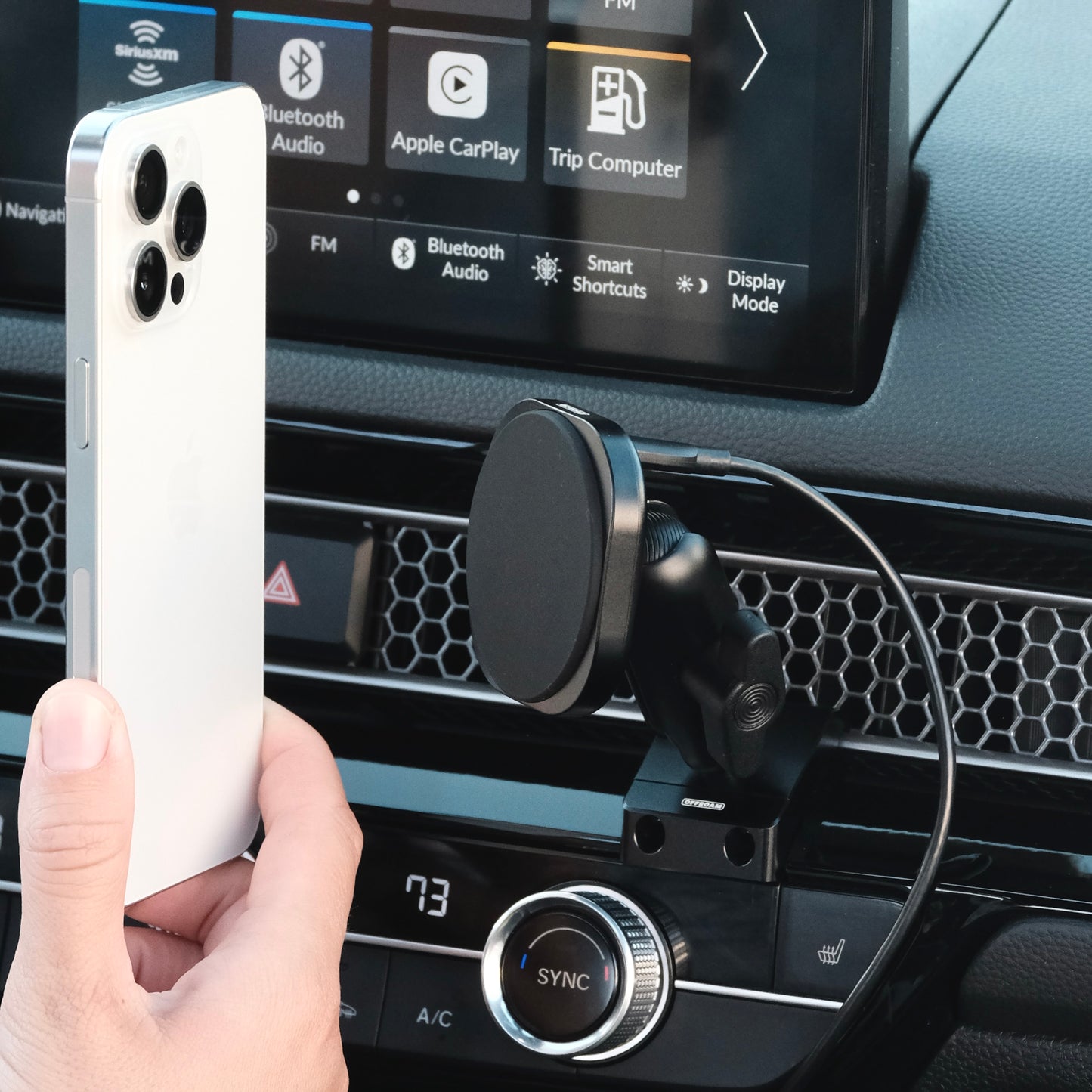 MagSafe-compatible Qi2 phone mount installed in a 2022–2025 Honda Civic / 2023–2025 CR-V, with phone held next to it to show magnetic alignment.
